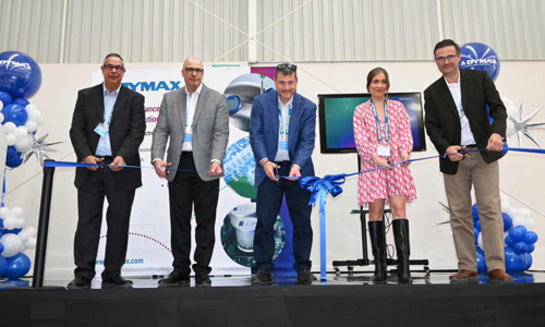 Dymax representatives and local Queretaro officials celebrate the opening of the Mexico distribution center at a ribbon-cutting ceremony.